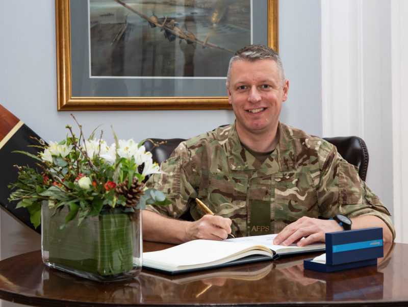 Luke signs the Visitor