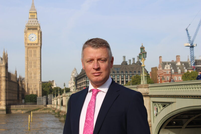 Luke MP stood in front of Parliament and Big Ben