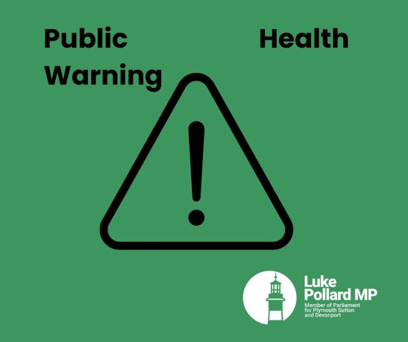 Warning triangle on green background